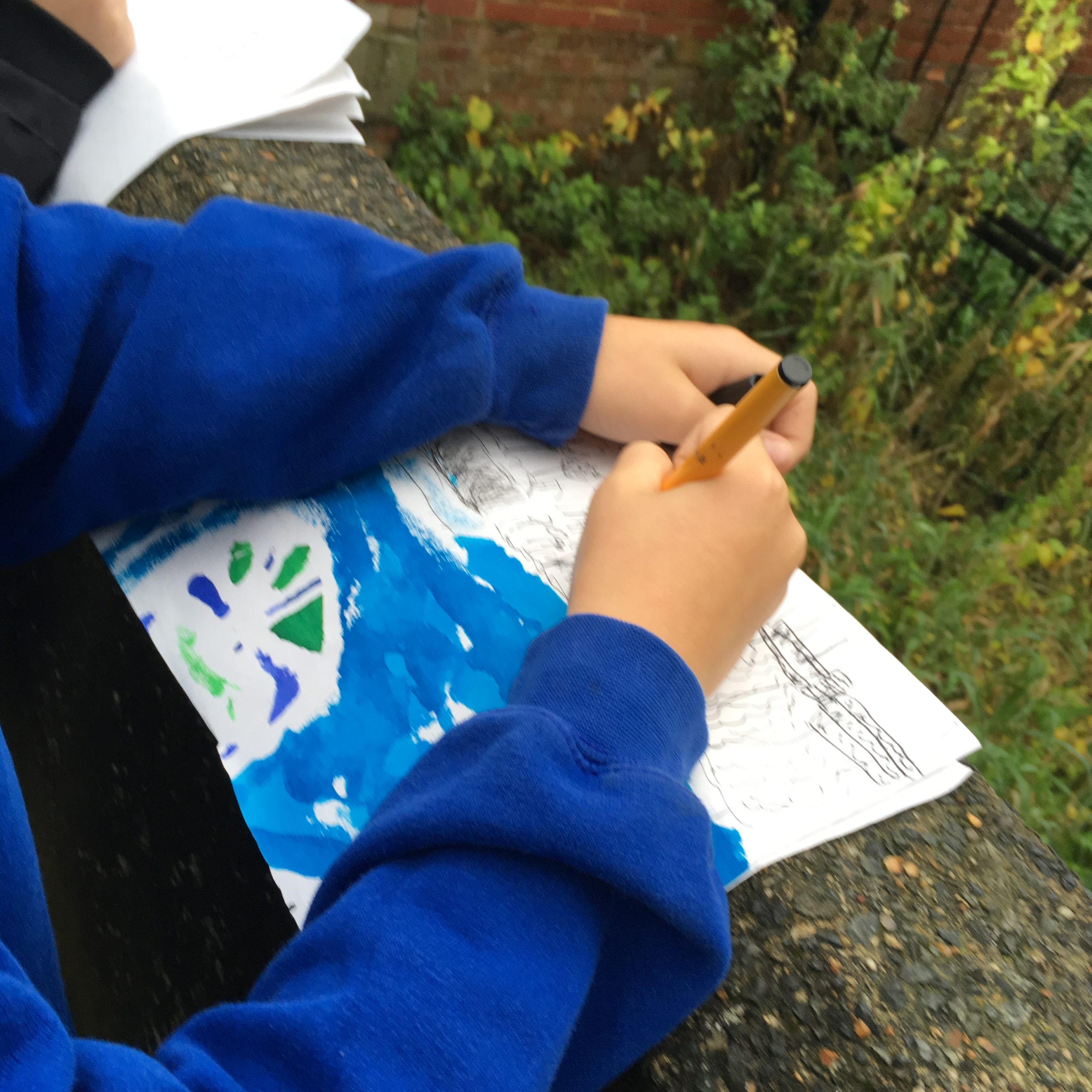 Child sketching trees