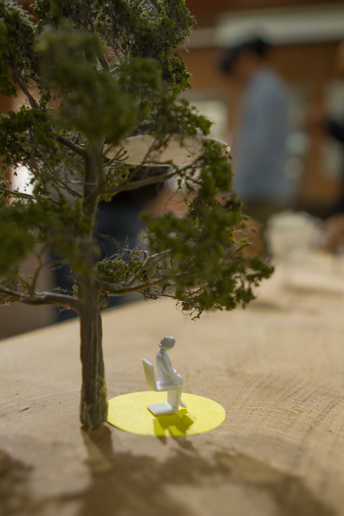 Model of tree with person sat underneath