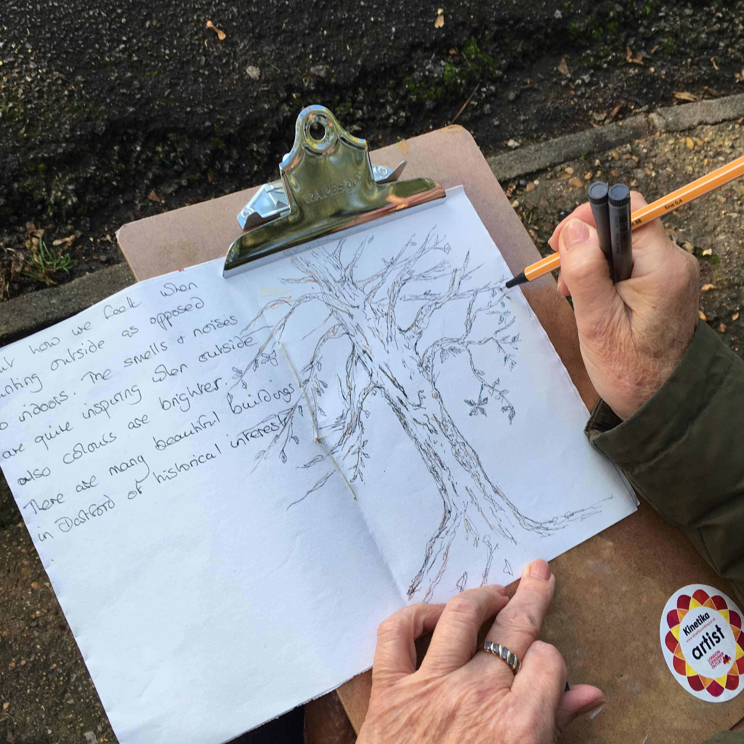 Book with sketched picture of tree and writing