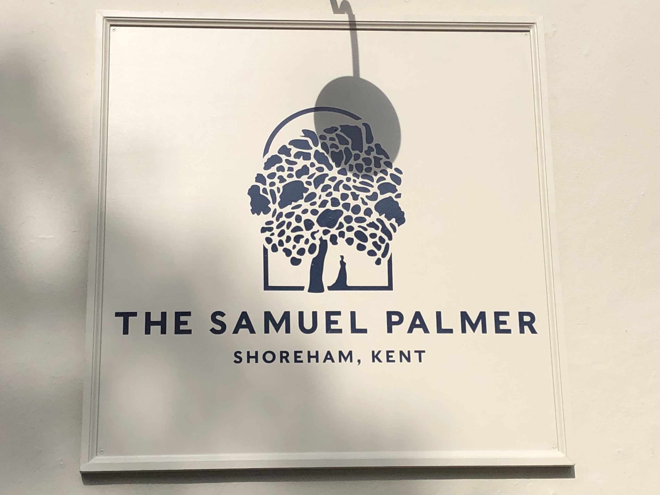 Cream sign saying The Samuel Palmer